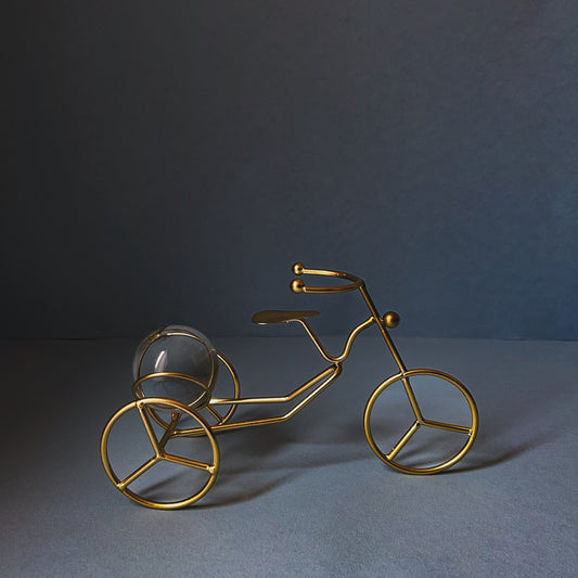 Decorative gold metal cycle with glass crystal